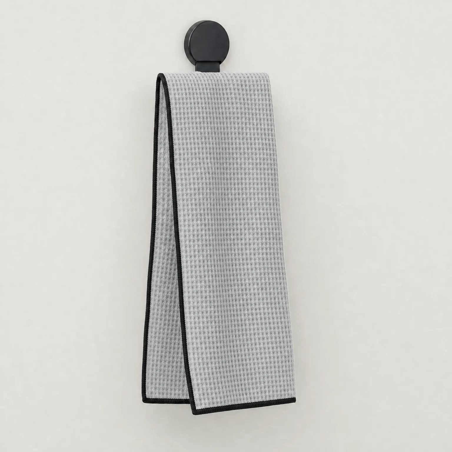 Silver waffle-weave golf towel with magnetic clip